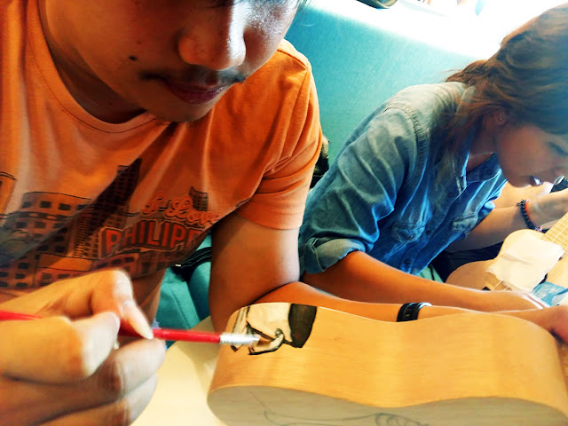 UkeHUB Kafe in Mactan Island Lapulapu City Cebu Philippines Painting a ukulele at UkeHUB Kafe in Mactan Island Lapulapu City Cebu Philippines